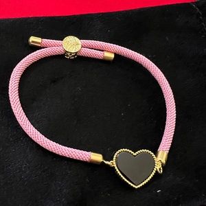 Charming pink bracelet with black heart onyx bordered with 18k gold stamped